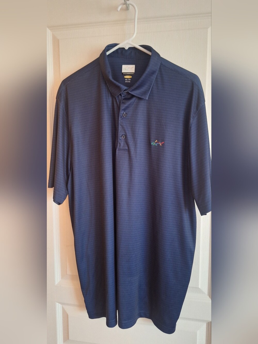 Greg Norman Collection Navy Polo with Multicolor Shark Logo